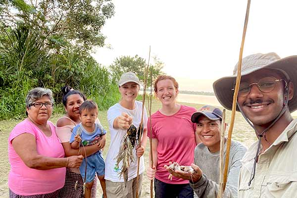 Interns fishing with their host families